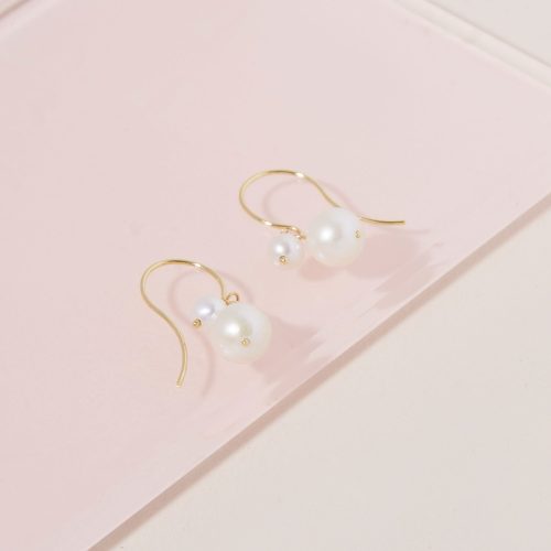 BUDDY PEARL HOOK EARRINGS EDITORIAL