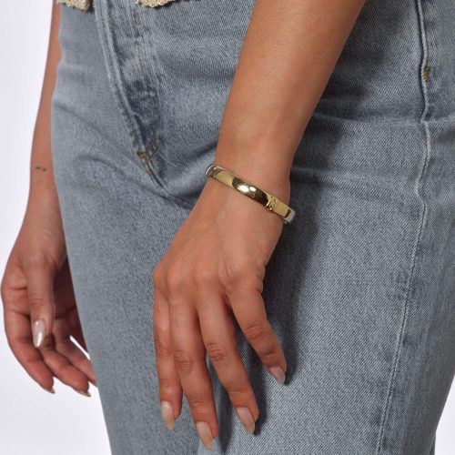 GOLD CIGAR BANGLE ON BODY