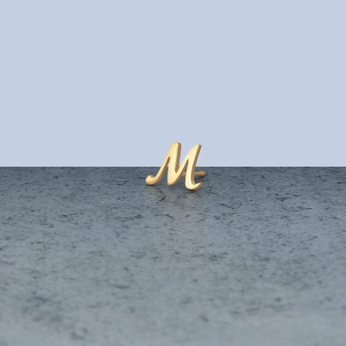 GOLD CURSIVE INITIAL STUD EDITORIAL M