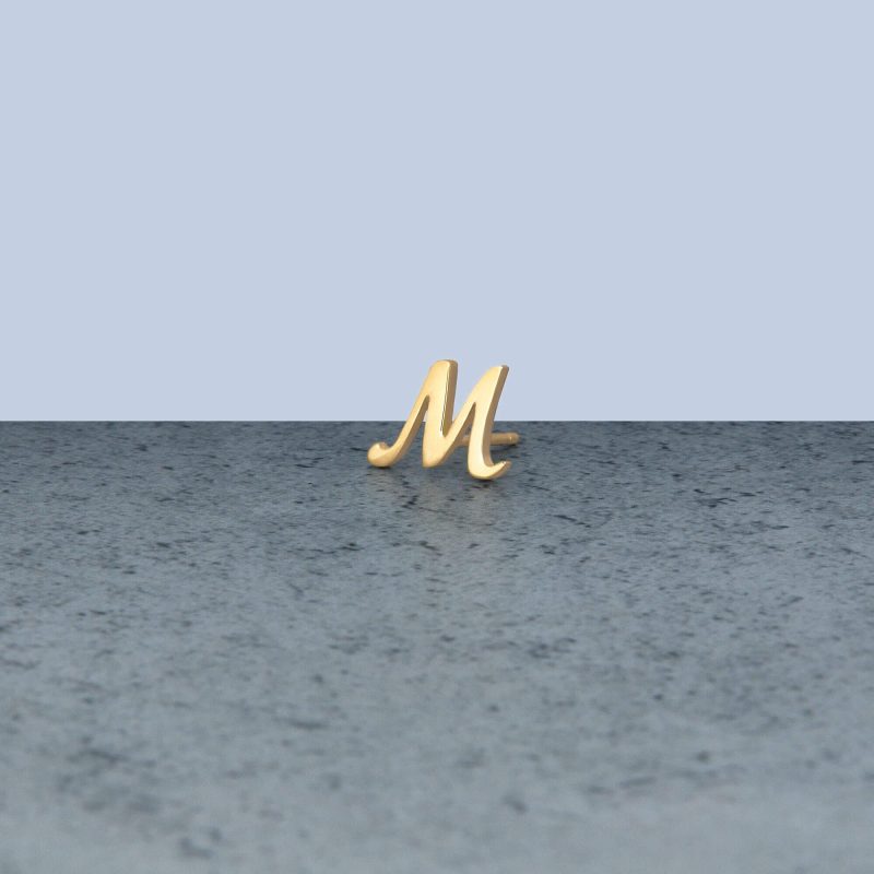 GOLD CURSIVE INITIAL STUD EDITORIAL M