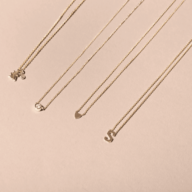 GOLD INITIAL NECKLACE EDITORIAL COLLECTION 1