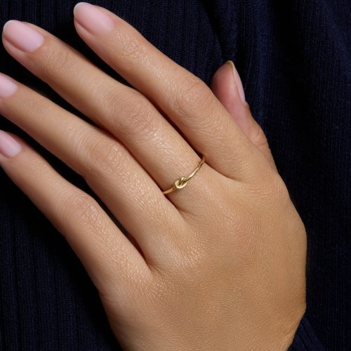 GOLD KNOT RING ON BODY