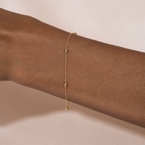 GOLDEN BEADS BRACELET ON BODY