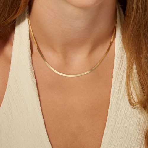 GOLDEN GLOW HERRINGBONE NECKLACE ON BODY