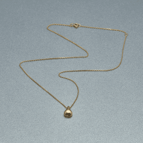 Gold Drop Necklace Still Life