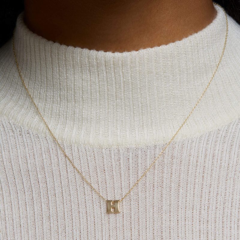 LETTERPRESS INITIAL NECKLACE ON BODY b5204ba1 a05f 498d ae1a 4a9f341e1668