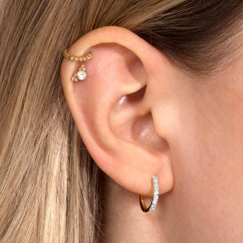 MEDIUM DIAMOND PAVE HUGGIE EARRINGS ON BODY