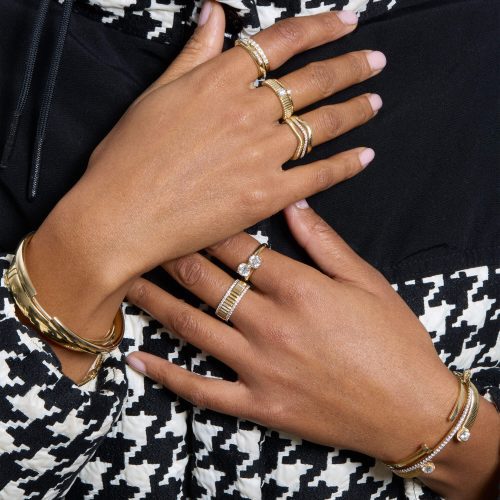 MODEL WEARING BRACELETS AND RINGS