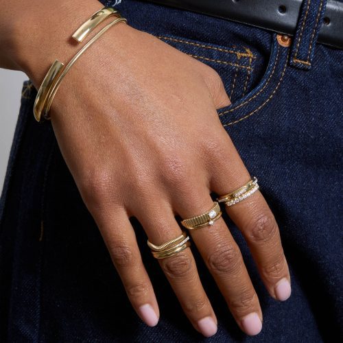 MODEL WEARING RINGS AND BRACELETS