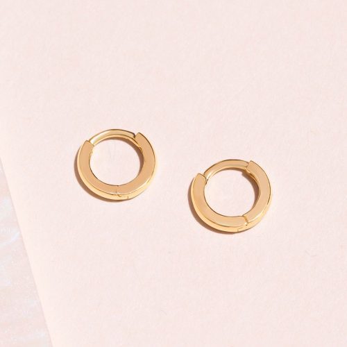 SECOND HOLE TEENY GOLD HUGGIE CLICKER EARRING EDITORIAL