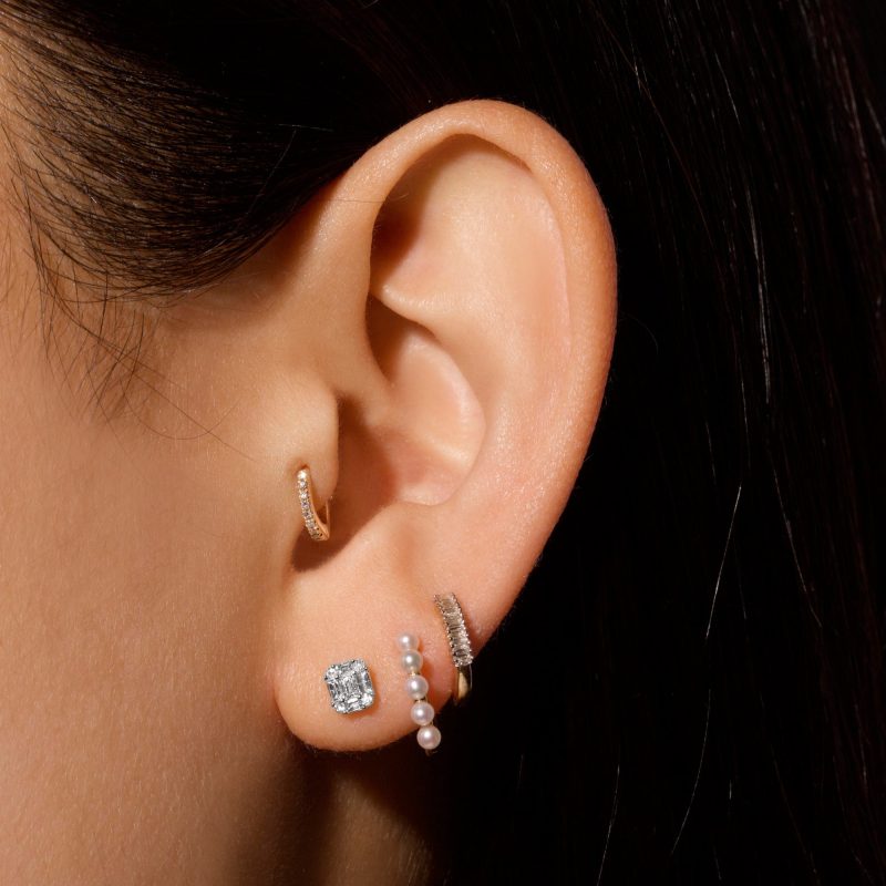 SHIELD OF STRENGTH STUD EARRINGS ON BODY