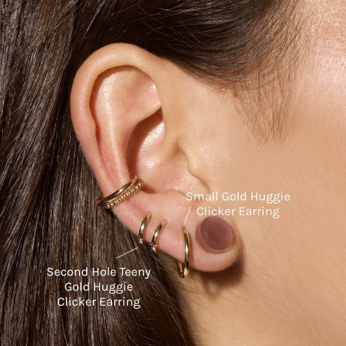 SMALL GOLD HUGGIE CLICKER EARRING ON BODY