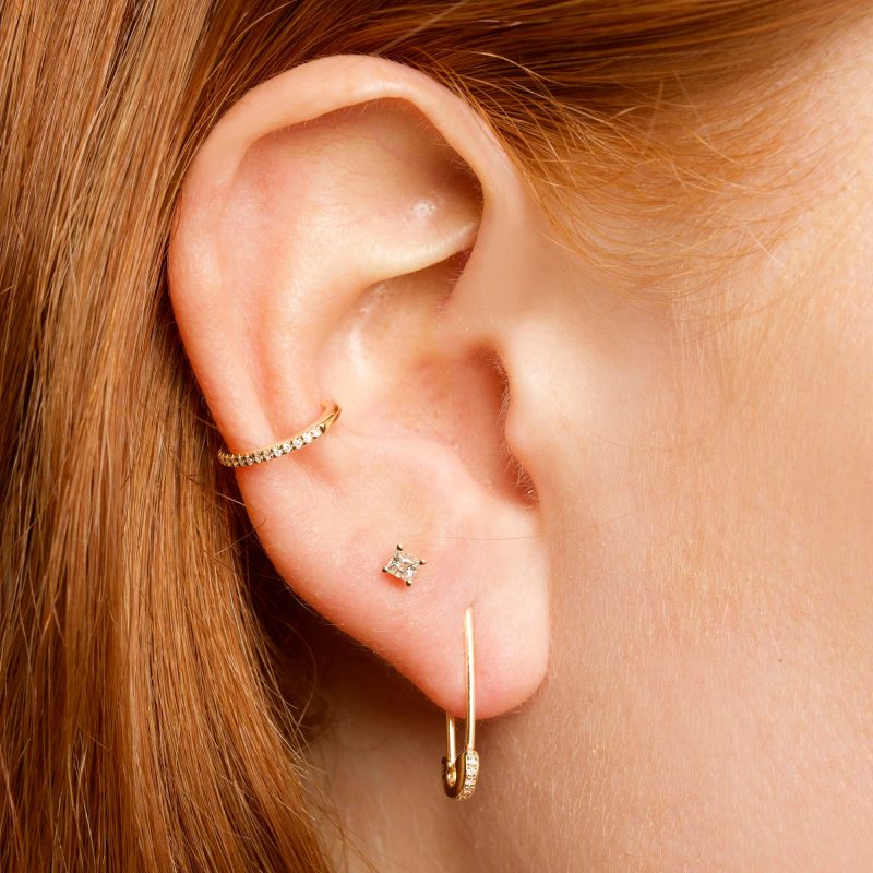 SPARKLE SAFETY PIN EARRING ON BODY