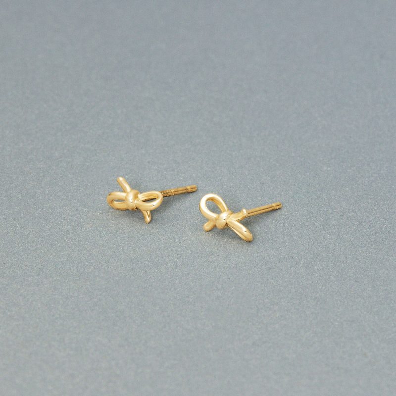 TEENY GOLD BOW STUDS EDITORIAL