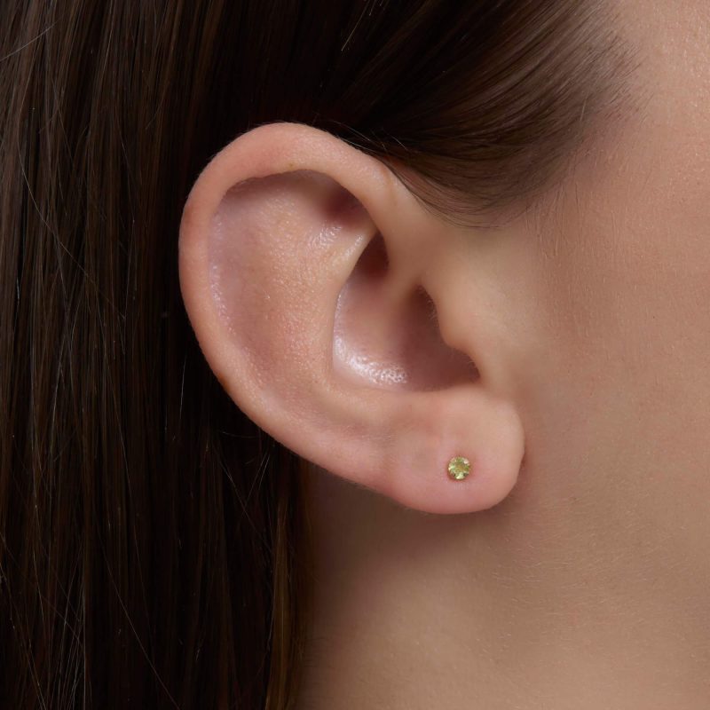 TINY BIRTHSTONE EARRINGS PERIDOT ON BODY