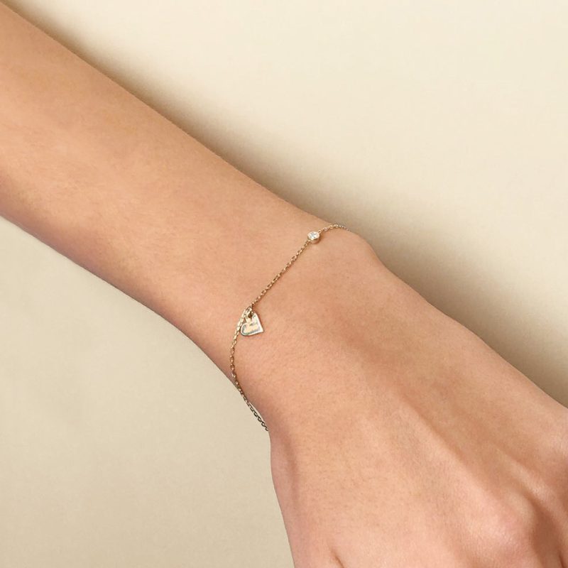 TINY DIAMOND HEART CHARM BRACELET ON BODY