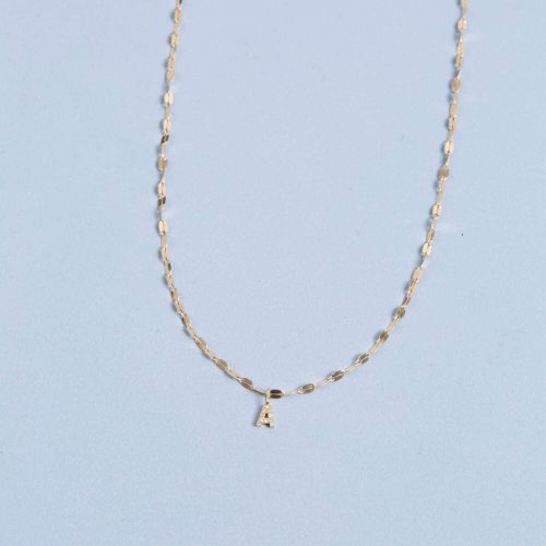 TINY DIAMOND INITIAL SPARKLE CHOKER STILL LIFE