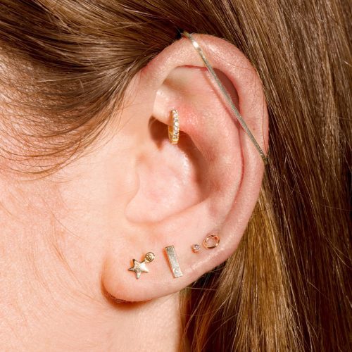 TINY OPEN CIRCLE STUD EARRING ON BODY