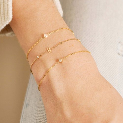 TINY PEARL AND GOLD BEAD INITIAL BRACELET WEAR IT WITH